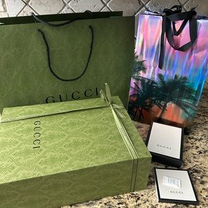 Gucci shopping bags, gift boxes & 2 ribbons.